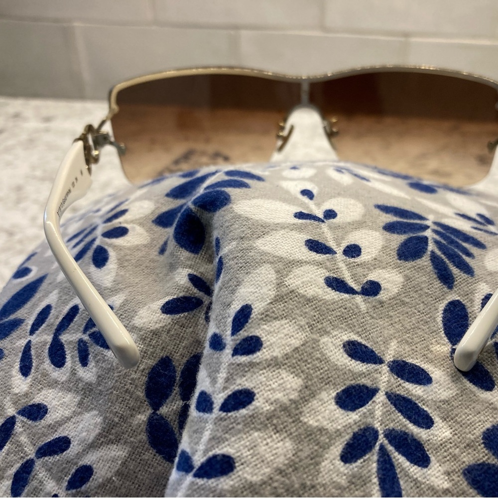 Women’s white Coach sunglasses